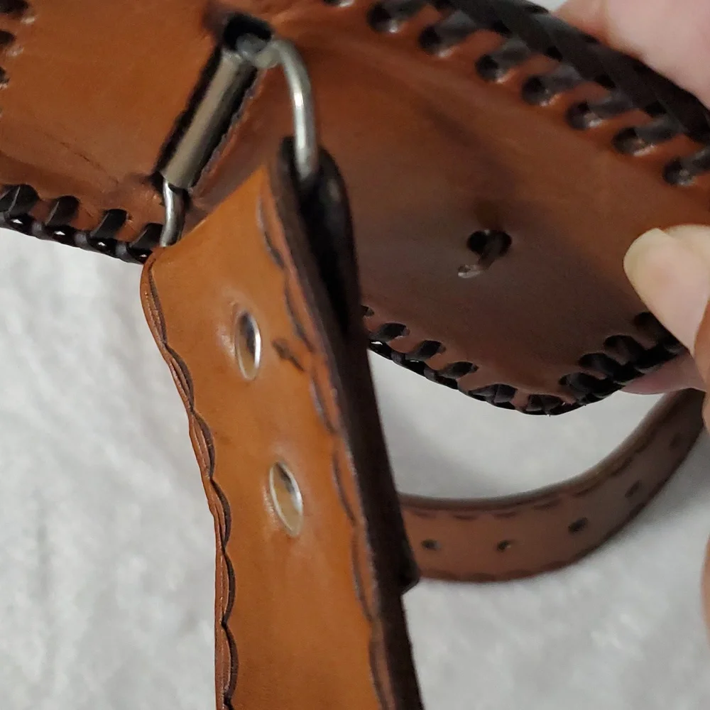 Vintage Leather Belt With Eagle Buckle and Details Embossed Along the Strap.